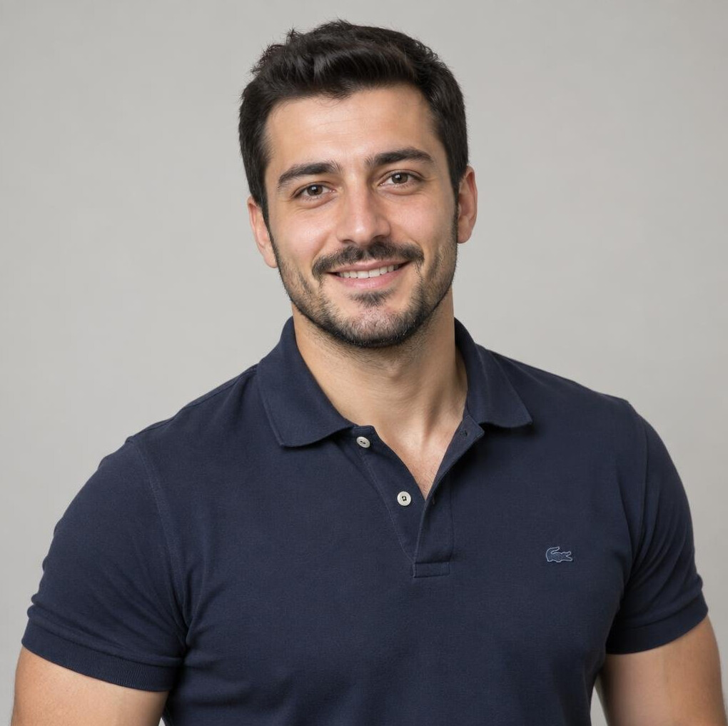 Studio portrait of a young Turkish man smiling
